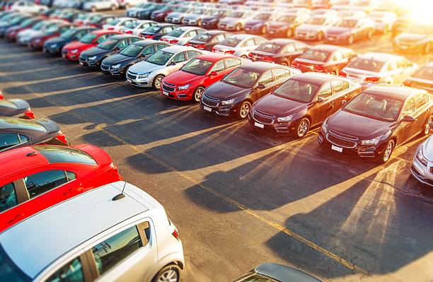 Image Depicts Multiple Vehicles For Sale At A Car Dealership