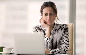 Image Shows Woman Looking Confused At Her Computer Screen